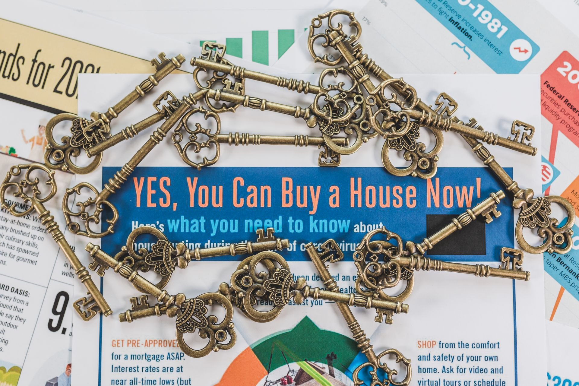 House keys on a guide about buying a home