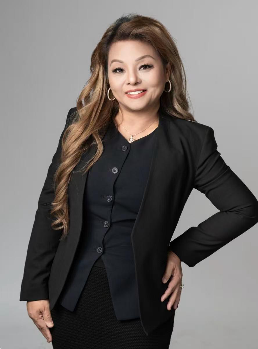 Portrait of Haydeelyn De Dios in a black suit